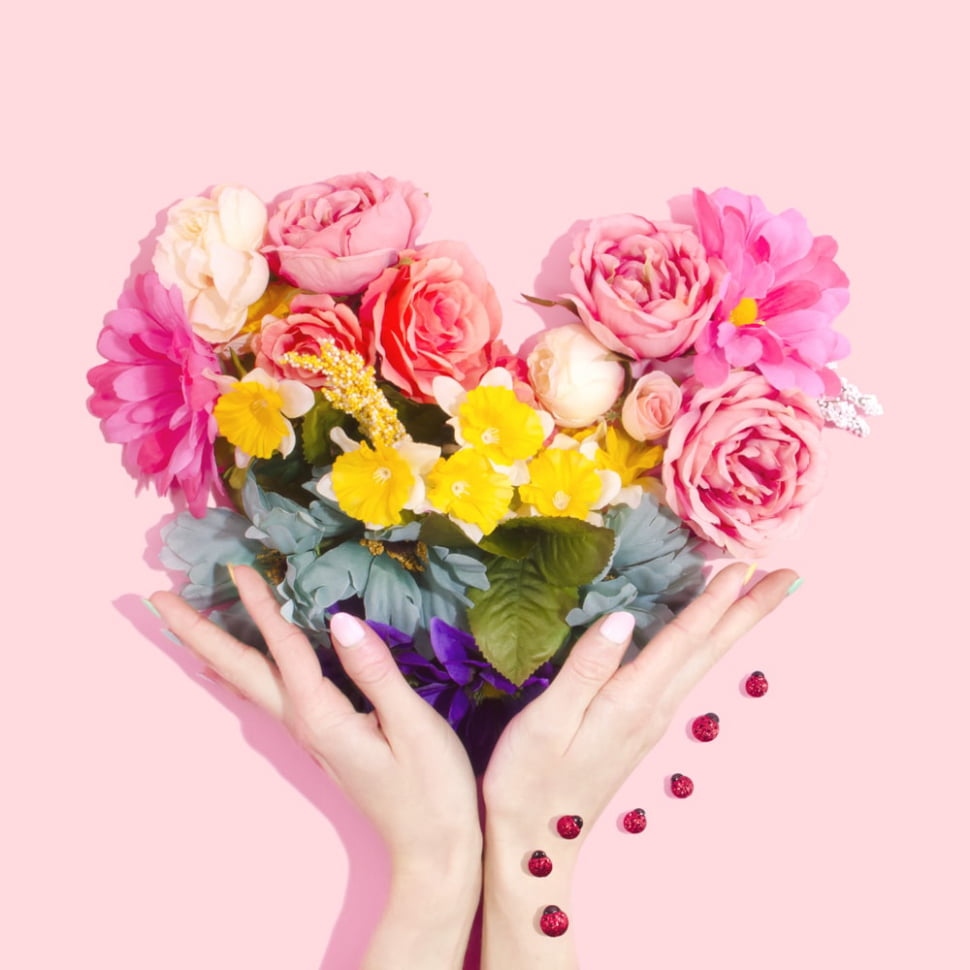 Flowers in Heart Shape With Hands
