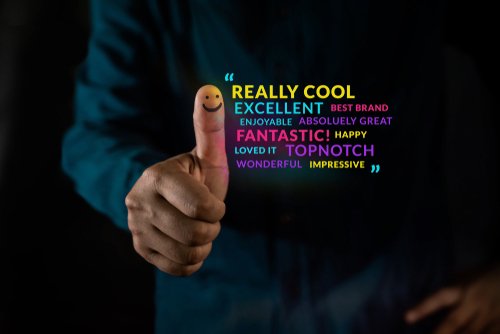A man gives a thumbs up surrounding by positive tone words