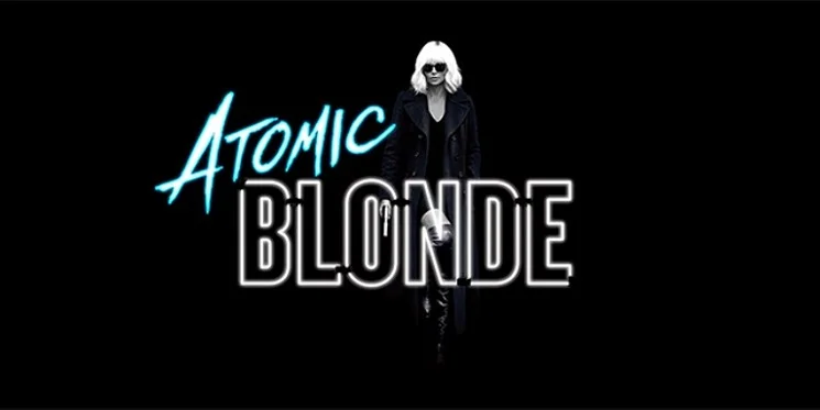 A tall, blonde woman in black and white stands against the words "Atomic" in aqua blue and "blonde" in bold, black letters outlined in white. All against a black background