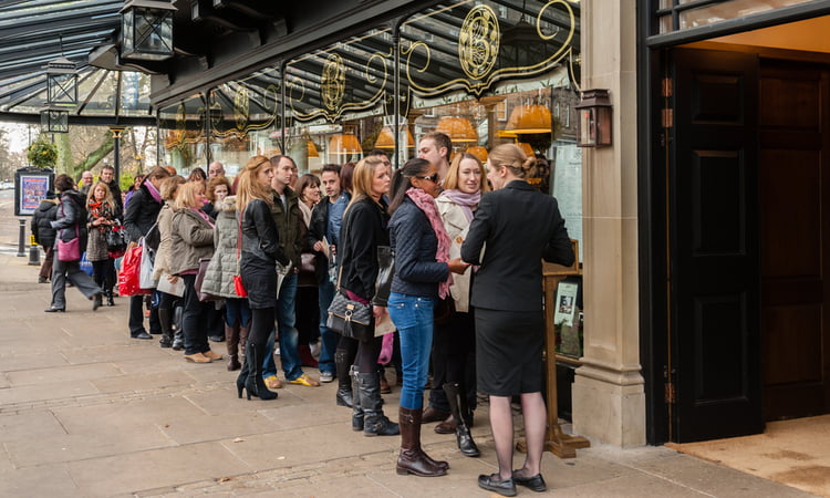 waiting in line for a table at an exclusive restaurant